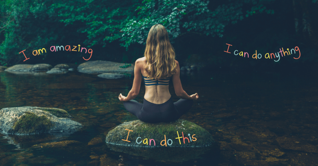 A woman meditating outdoors on a rock in a peaceful forest stream, with colorful affirmations like “I am amazing,” “I can do anything,” and “I can do this” floating around her, symbolizing the mental impact of positive self-talk.
